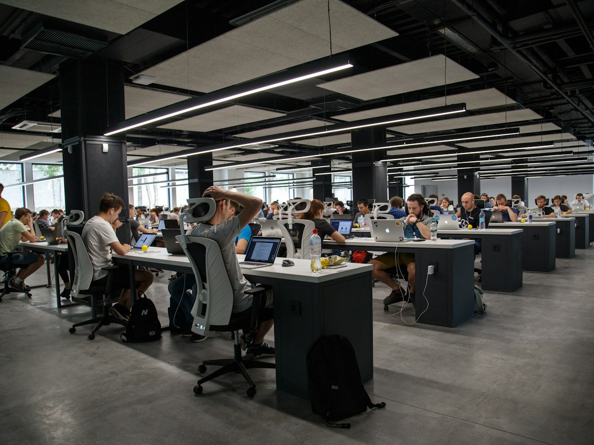 A large open-plan office with teams at work