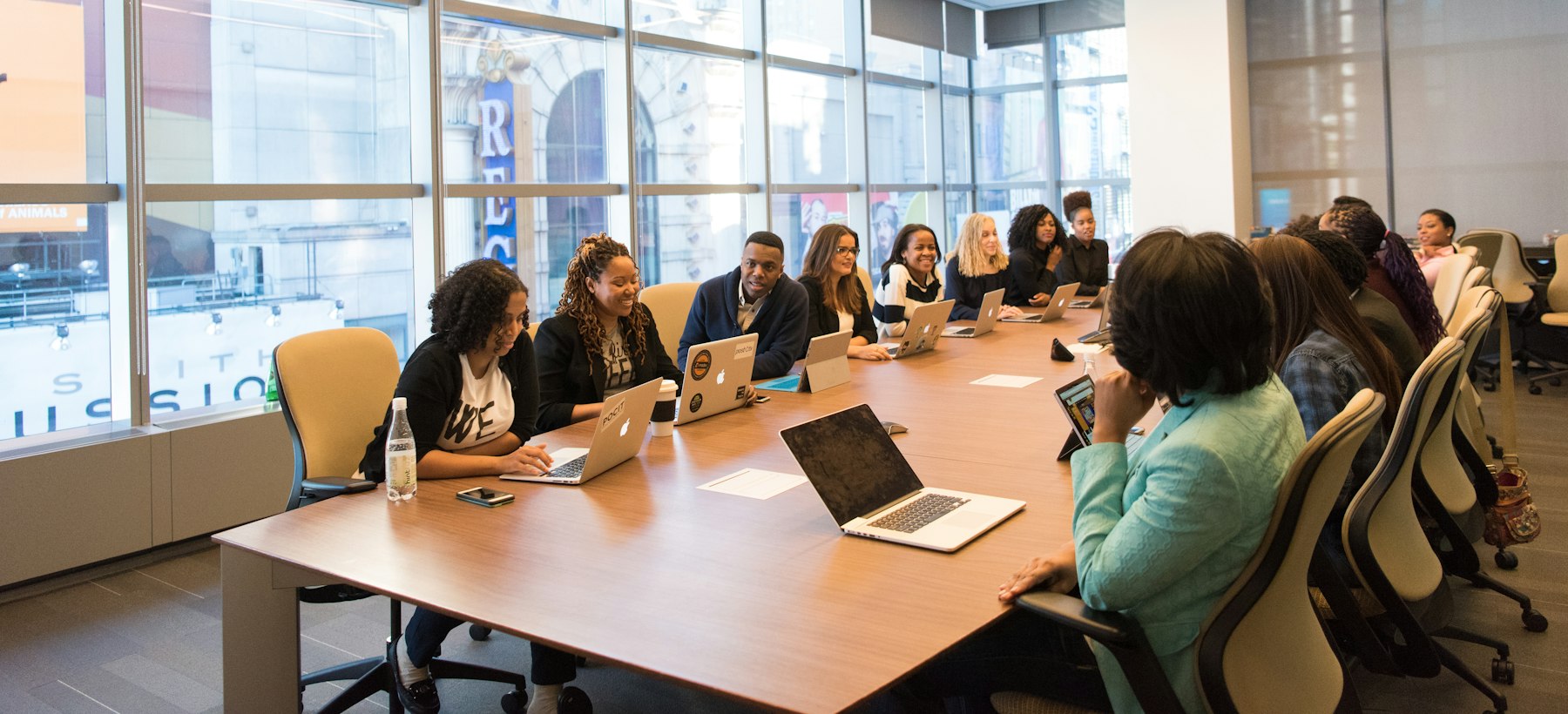 A project team working together around a boardroom table